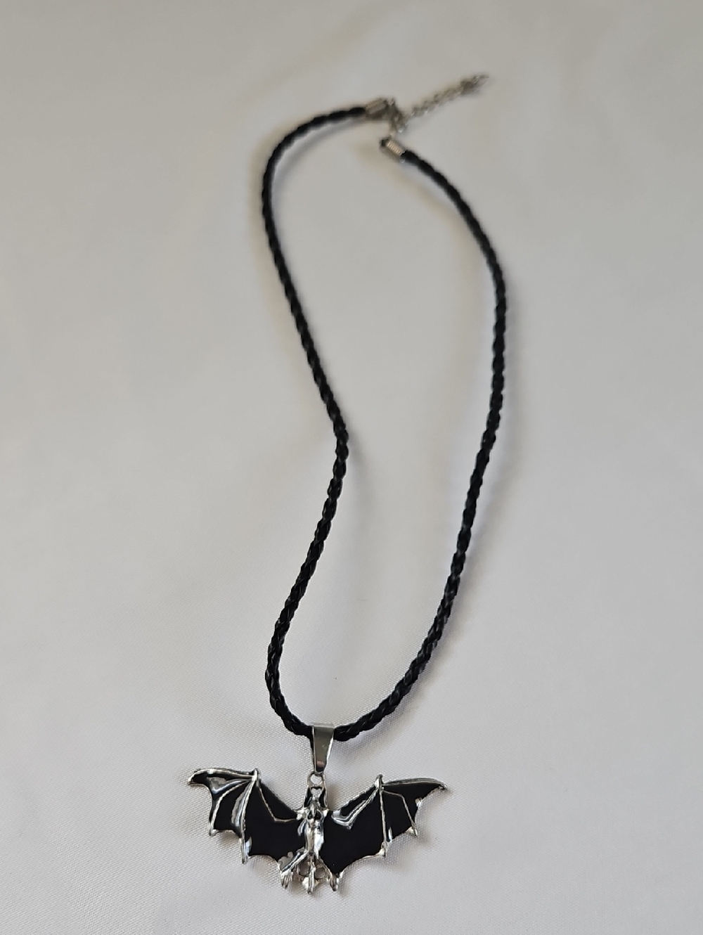 Black Braided Necklace with Silver And Black Bat Pendant